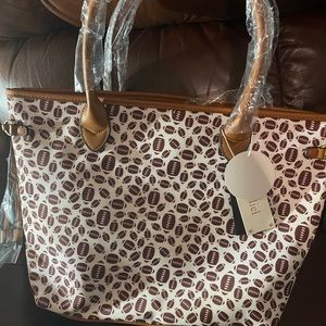 Large football purse with matching makeup bag and wallet inside!